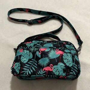 VGUC Lug scoop crossbody bag, pink flamingo palm leaves. 10”W x 7”H x 3.5”D.